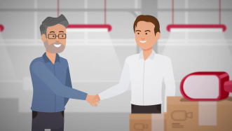 2 personages schudden de hand in fabriek